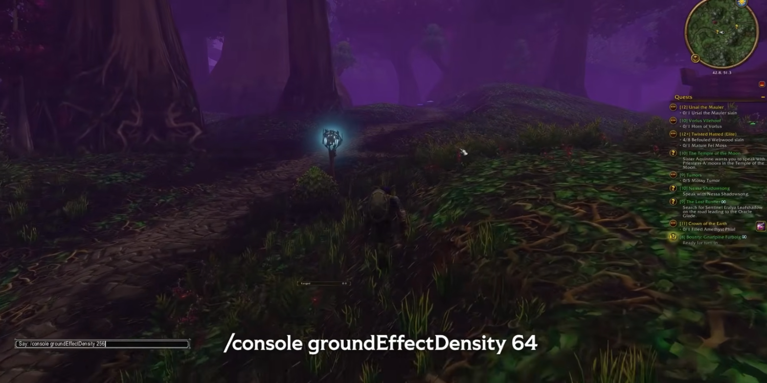 Sous-bois violet d'Orneval, sol couvert d'herbe haute, avec la commande console groundEffectDensity affichée à l'écran
